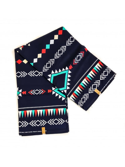 “KYRA 100 Cotton Wax Print Fabric in vibrant red geometric pattern”