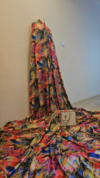 Draped MYSTIQUE Silk Fabric showing graceful flow and vibrant color">