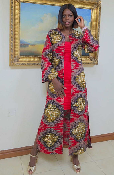 Woman wearing ROYAL EMBER Duster Kimono Coat with a striking pattern, standing in front of a gold-framed painting.
